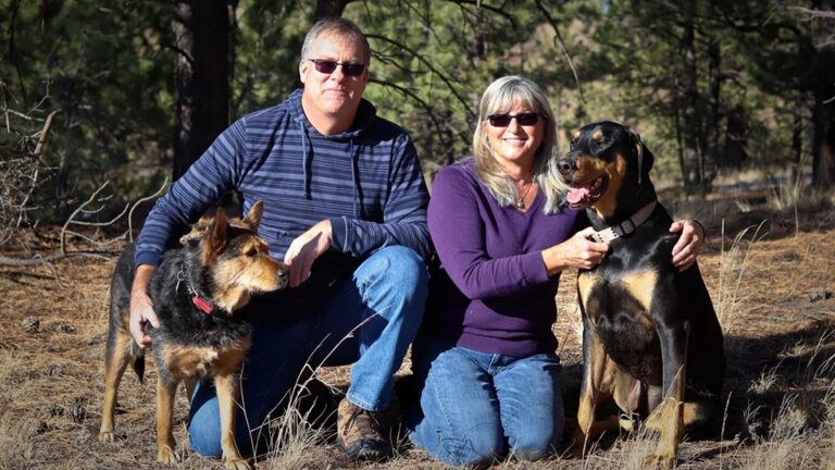 A couple and their dogs vacationing together.