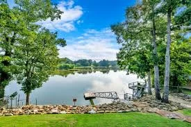Pet-friendly Smith Lake home with secure outdoor area and 2 Poochies Properties logo