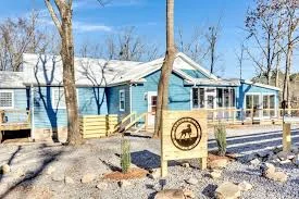 Modern Nashville vacation rental with a secure fenced yard and 2Poochies Properties logo - pet-friendly vacation rentals