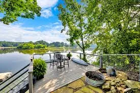 dog on lakefront deck with family